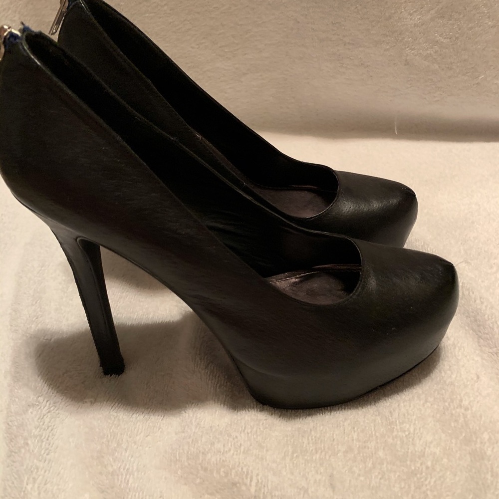 Super cute heels with zipper details. Worn once.